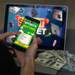 Businessman using smartphone against gambling app screen